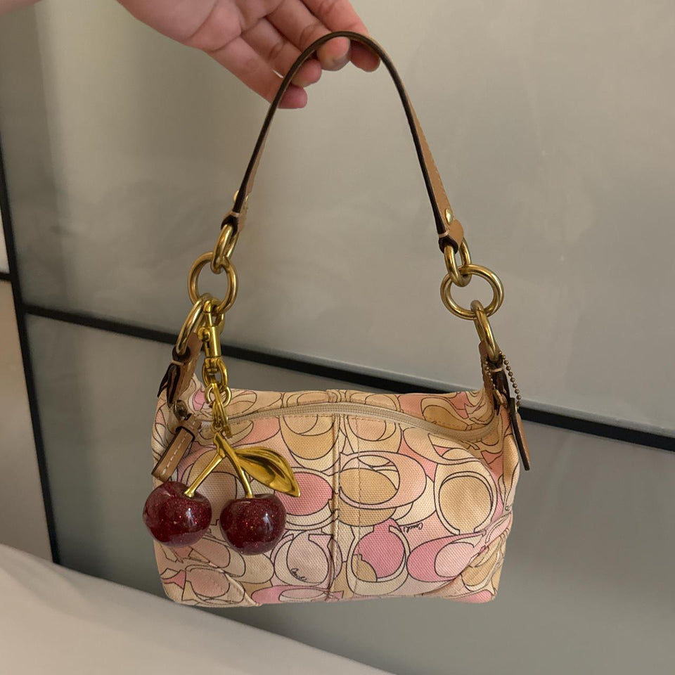 Cutest mini pink coach bag in very good condition