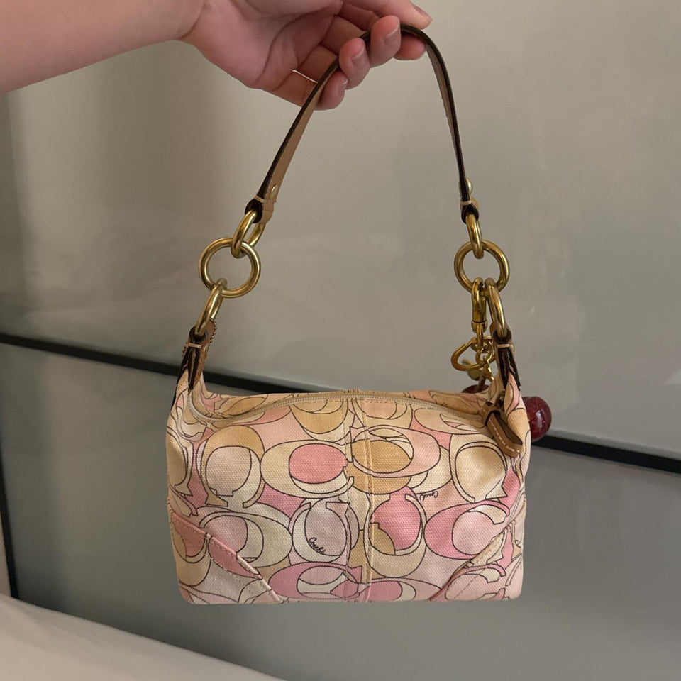 Cutest mini pink coach bag in very good condition